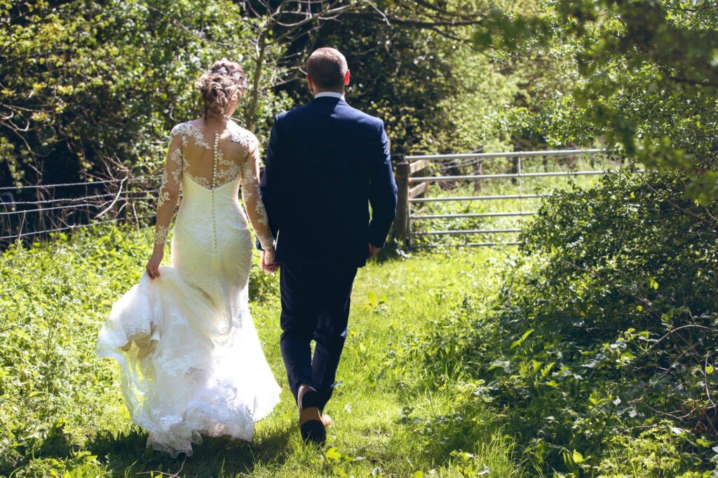 Bride and Groom walking away from the camera.