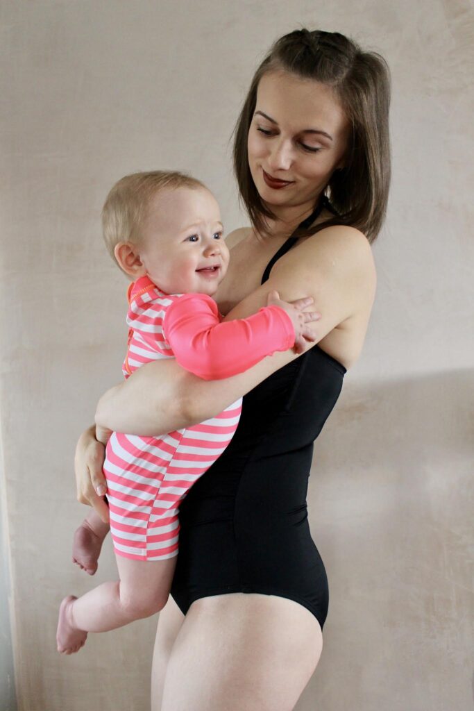 SWIMMING LESSON WITH LILYPAD SWIM. Mum holding baby wearing swimsuits.