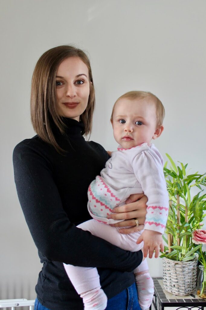 Woman holding a baby. This is to go with an article discussing the back to work fear after maternity leave.