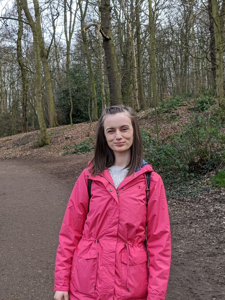 Woodland walks with Lighthouse Clothing. Mother wearing pink Lighthouse clothing raincoat.