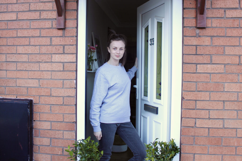 Claire Mac stood at the front door.
