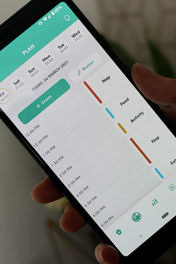 Mobile phone displaying the plan section of the app. Parents can input nap times, feeding times & activity times.
