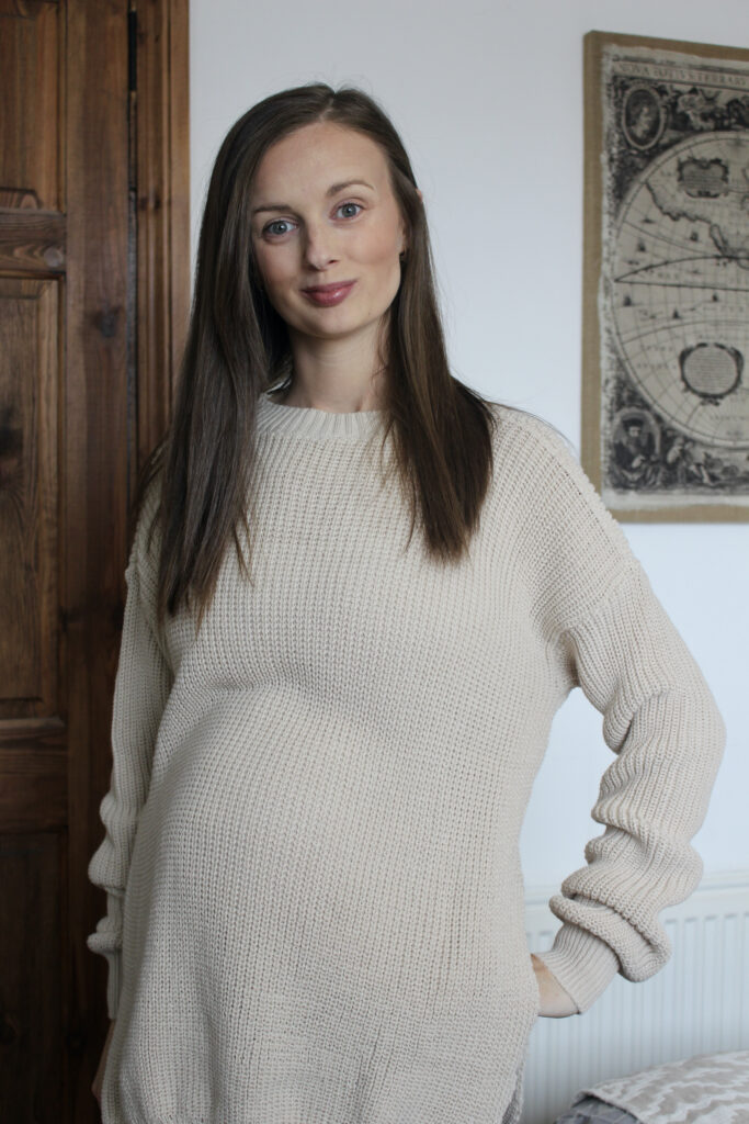 Claire Mac wearing oversized non maternity sweater from Femme Luxe.