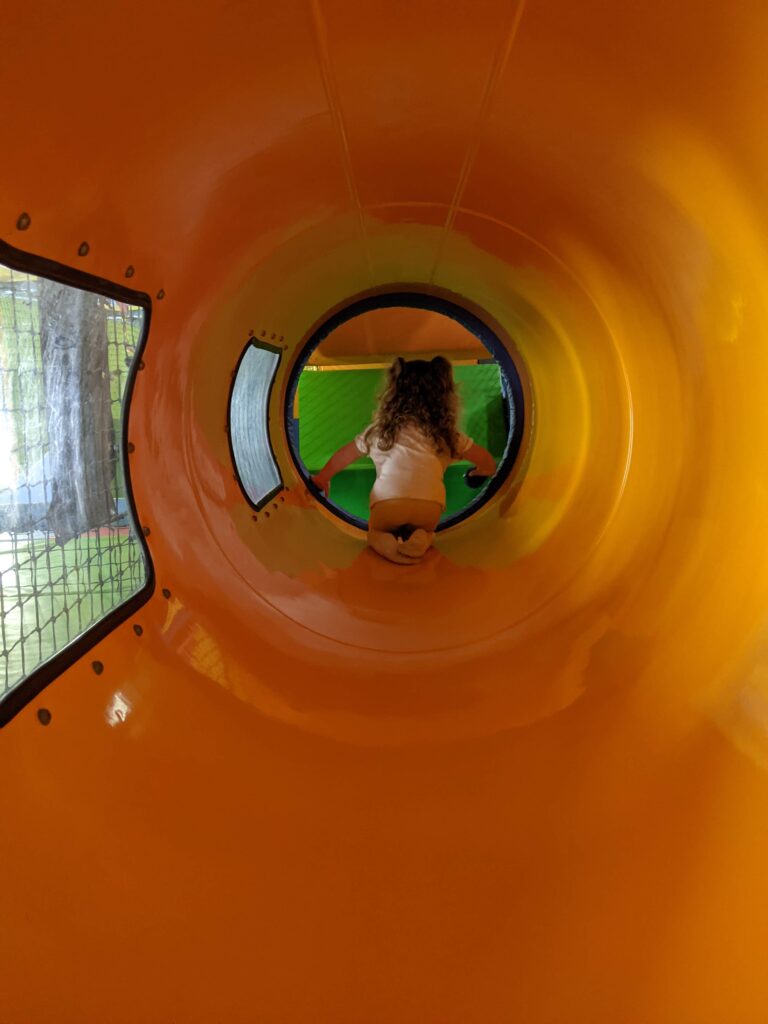 Crawling through the tunnels at soft play.