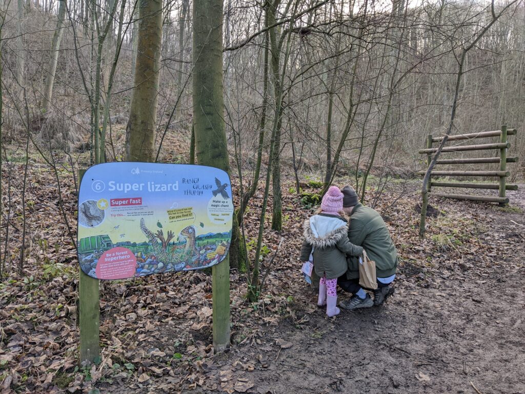 My husband and daughter discovering wizard lizard at the Superworm nature trail.