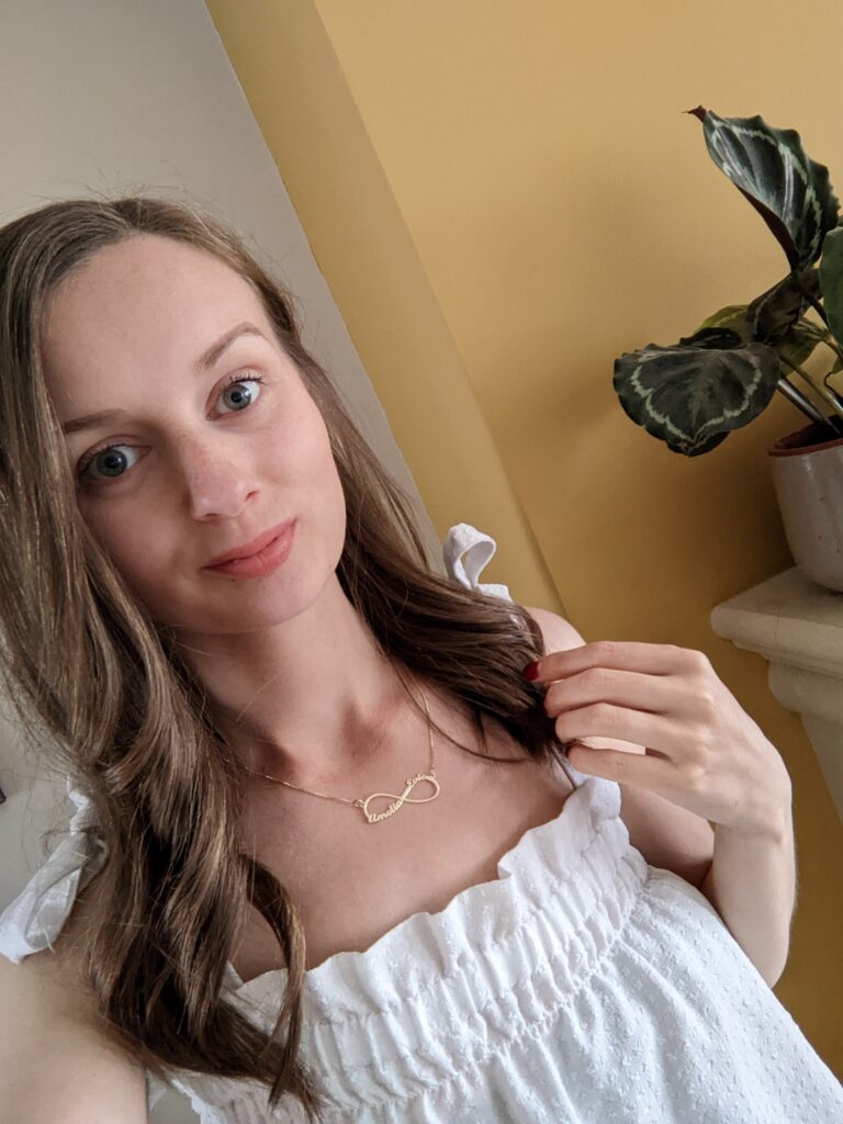 Claire Mac wearing the personalised infinity necklace from Joyamo.