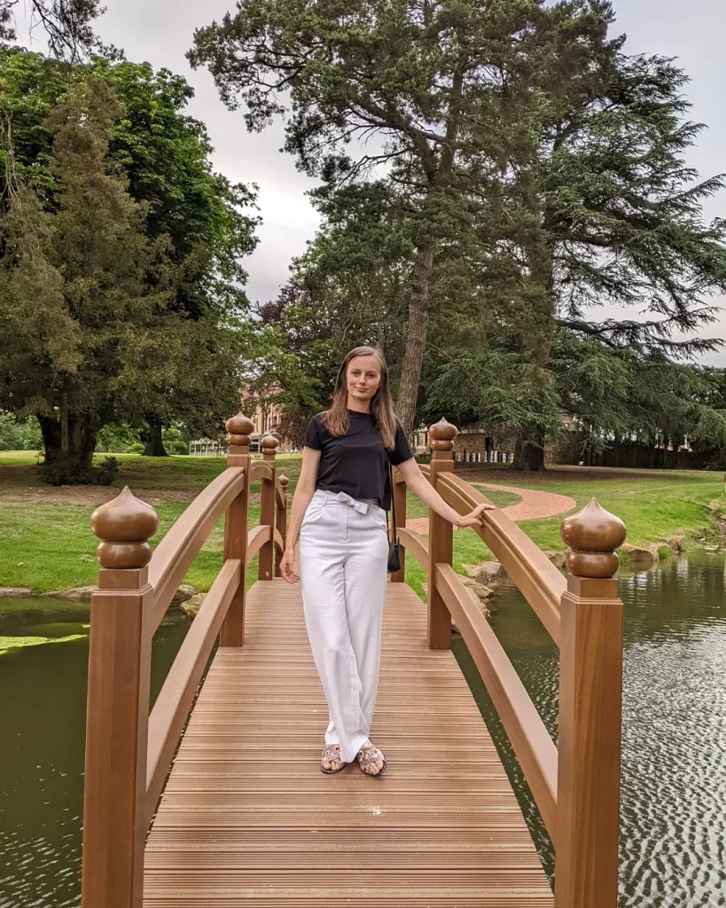 Claire Mac stood on the bridge at Aldwark Manor Estate.
