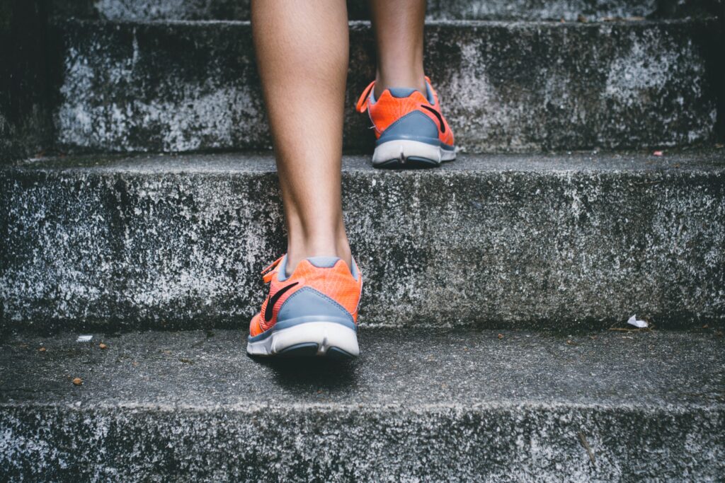 Running shoes running up steps.