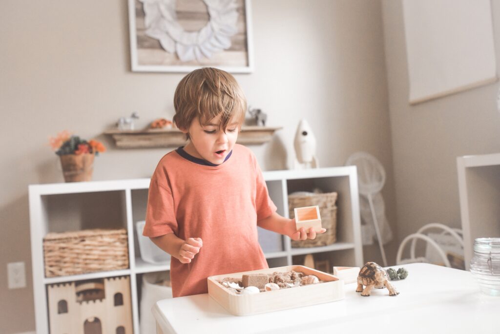 Young boy discovering his learning style through kinaesthetic play.