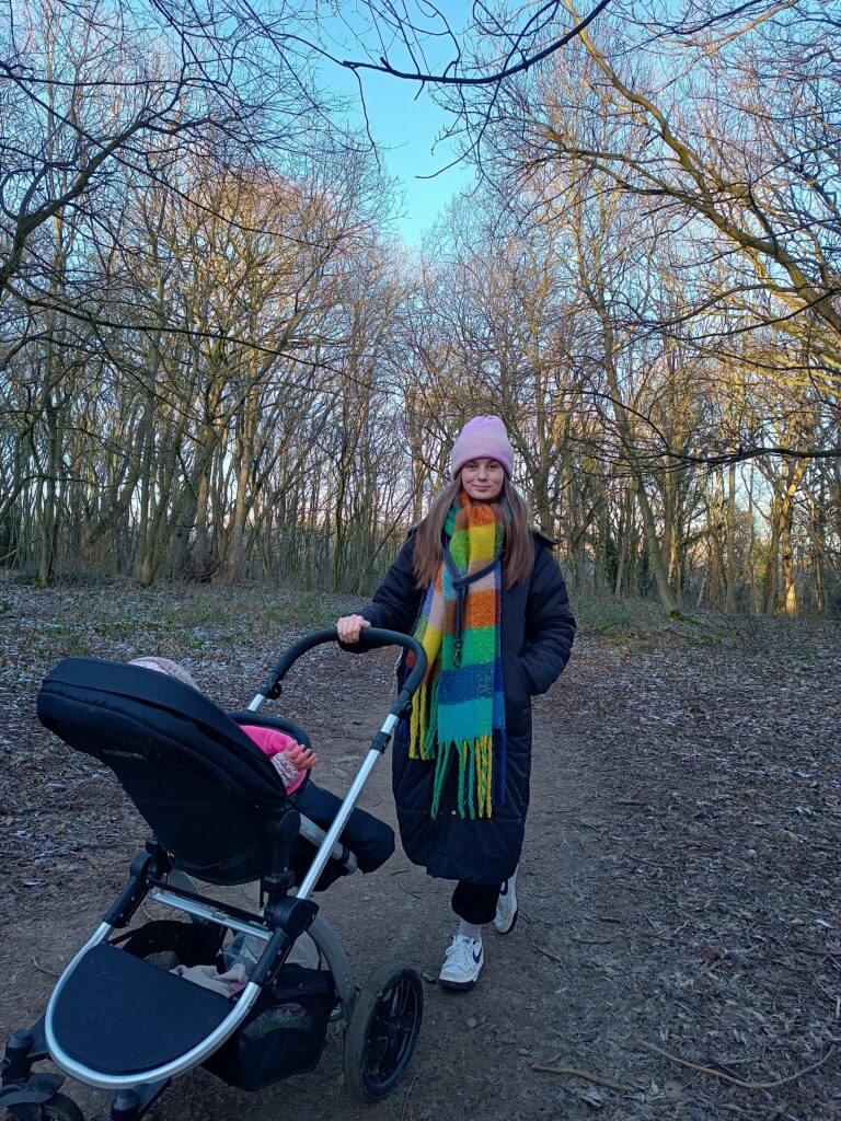 Mother walking with pram in the park. Losing yourself in motherhood is common, but there is a way out. This post tells you how.