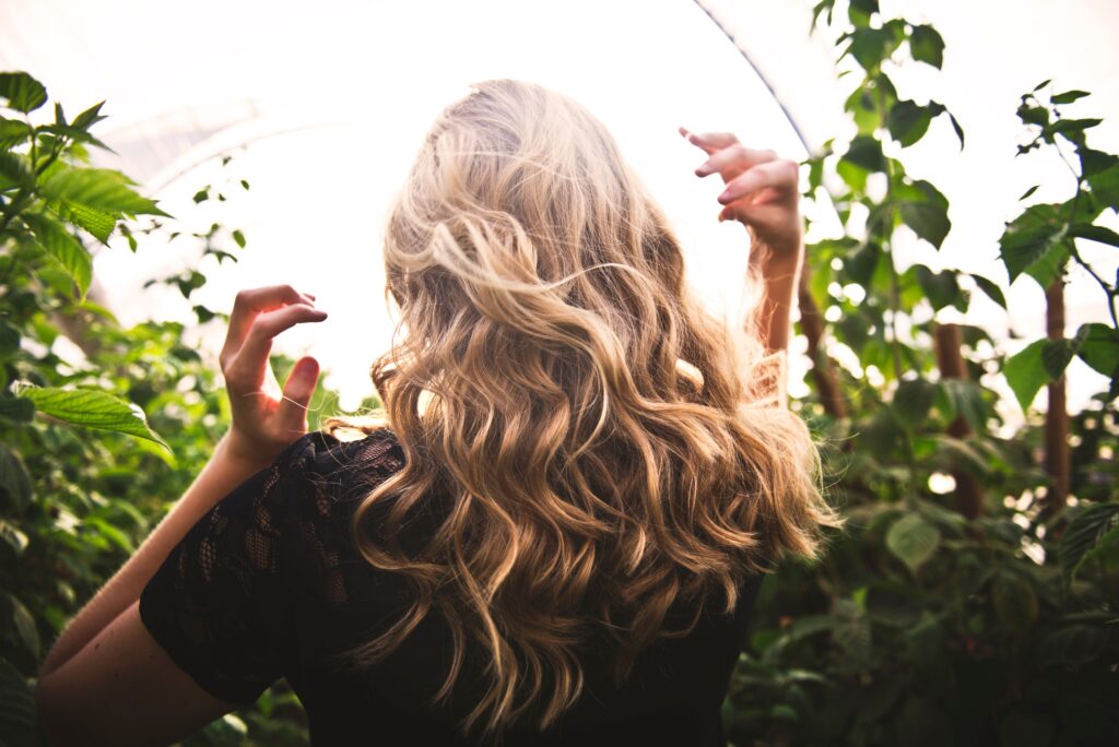 Hair curled using an angled hair curler.