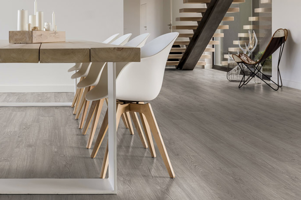 Table and chairs on vinyl flooring.