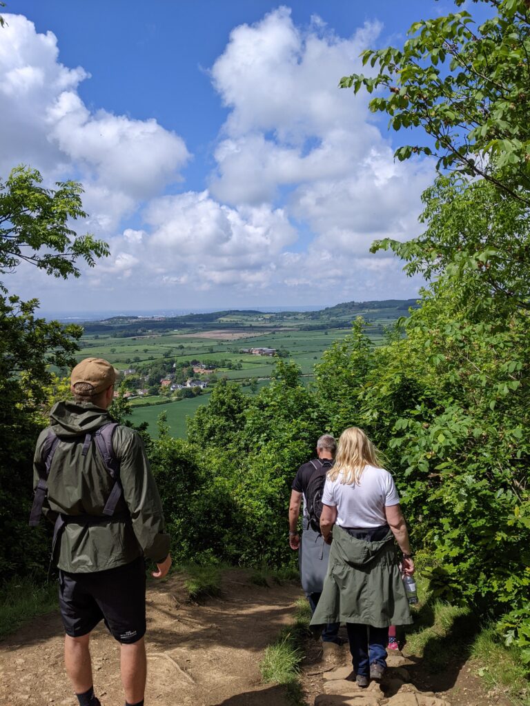 Family hiking back down Roseberry Topping.