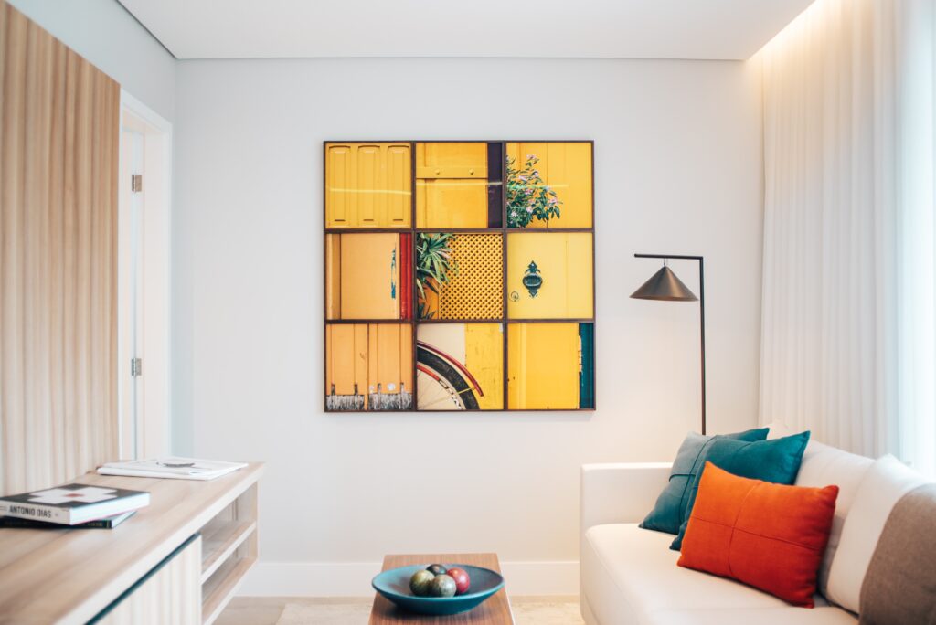 Wall art ideas. Nine squared wall art installation in modern style living room setting.