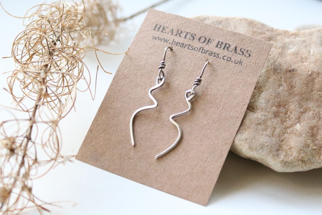 Hearts of Brass sterling silver earrings.