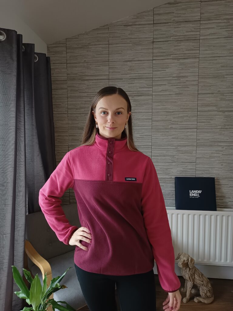 Claire Mac wearing burgundy fleece from Land's End.