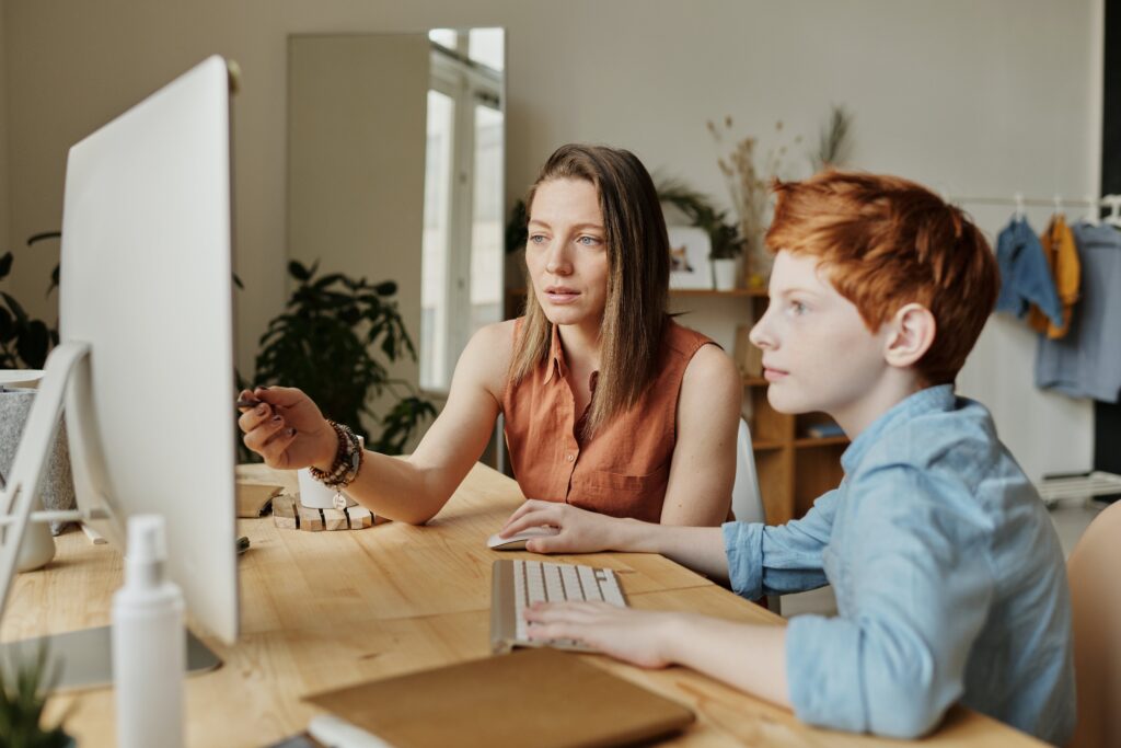 Mother helping son with school work. This is to go with an article discussing ways to overcome learning challenges.