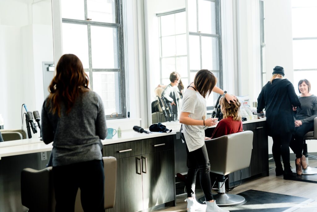 Image of hairdressers at work in a salon.