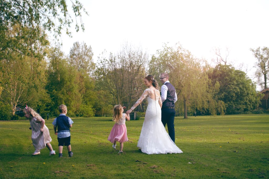 Bride and groom with children during wedding day. This is to go with an article giving tips on how to organise your wedding.