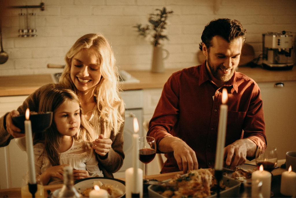 Family sat around the dining table. This it to go with an article about how to make divorce easier on your family.