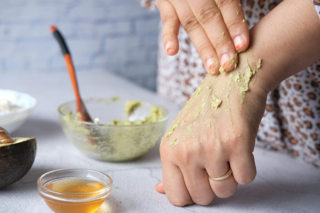 Avocado oil being used in a skincare setting.