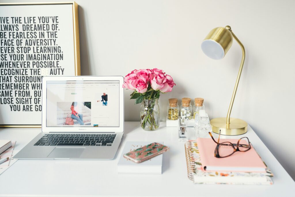 Desk set up with laptop and notebooks. This is to go with a blog post about affiliate marketing.