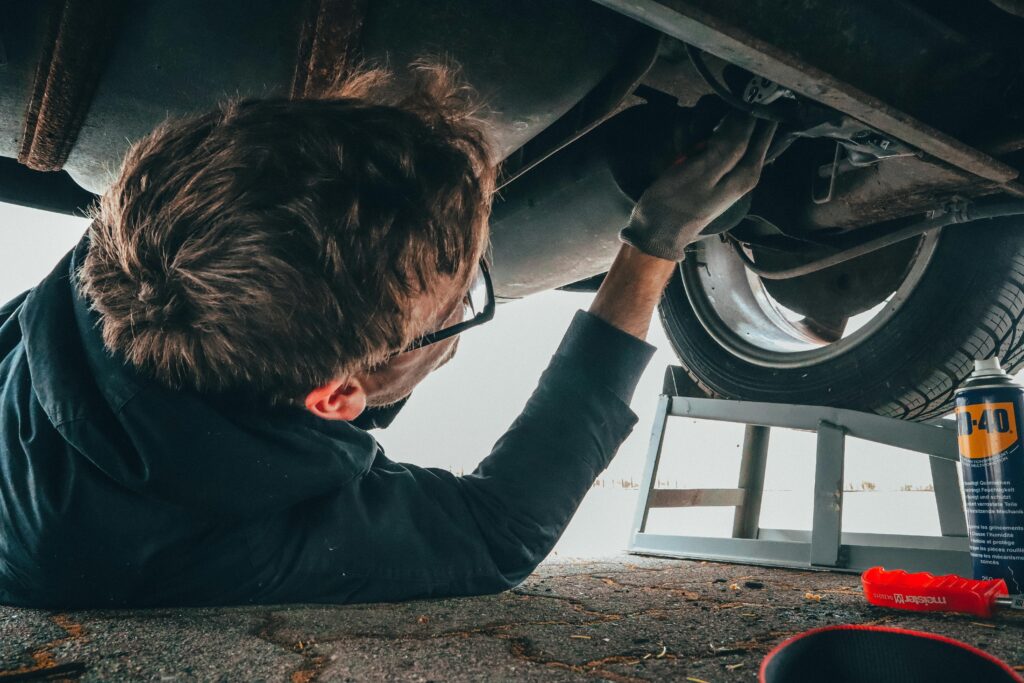 Mechanic completing car tech inspection.