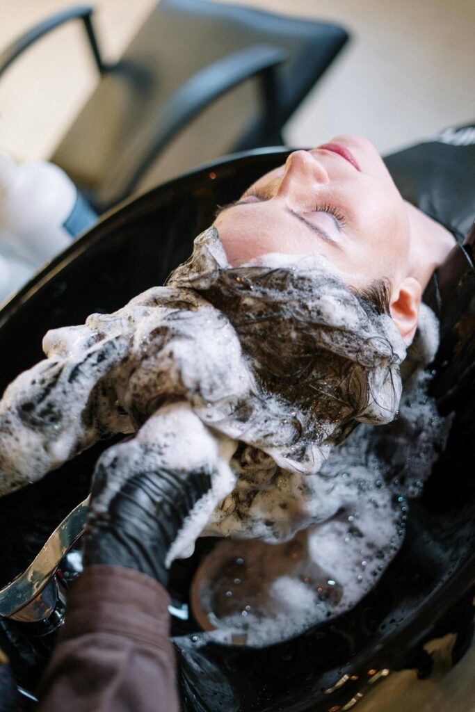 Woman having her hair washed at a salon.