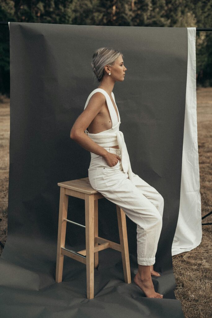 Woman with blonde hair doing a fashion photoshoot.