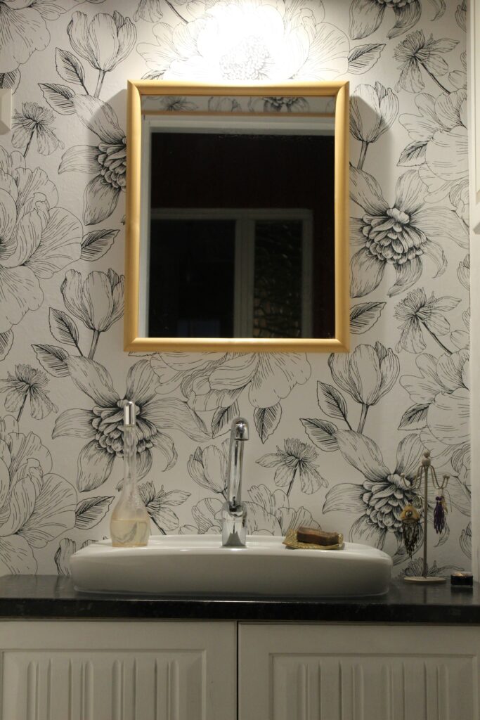 Bathroom updates you can do with wallpaper include feature walls such as this.