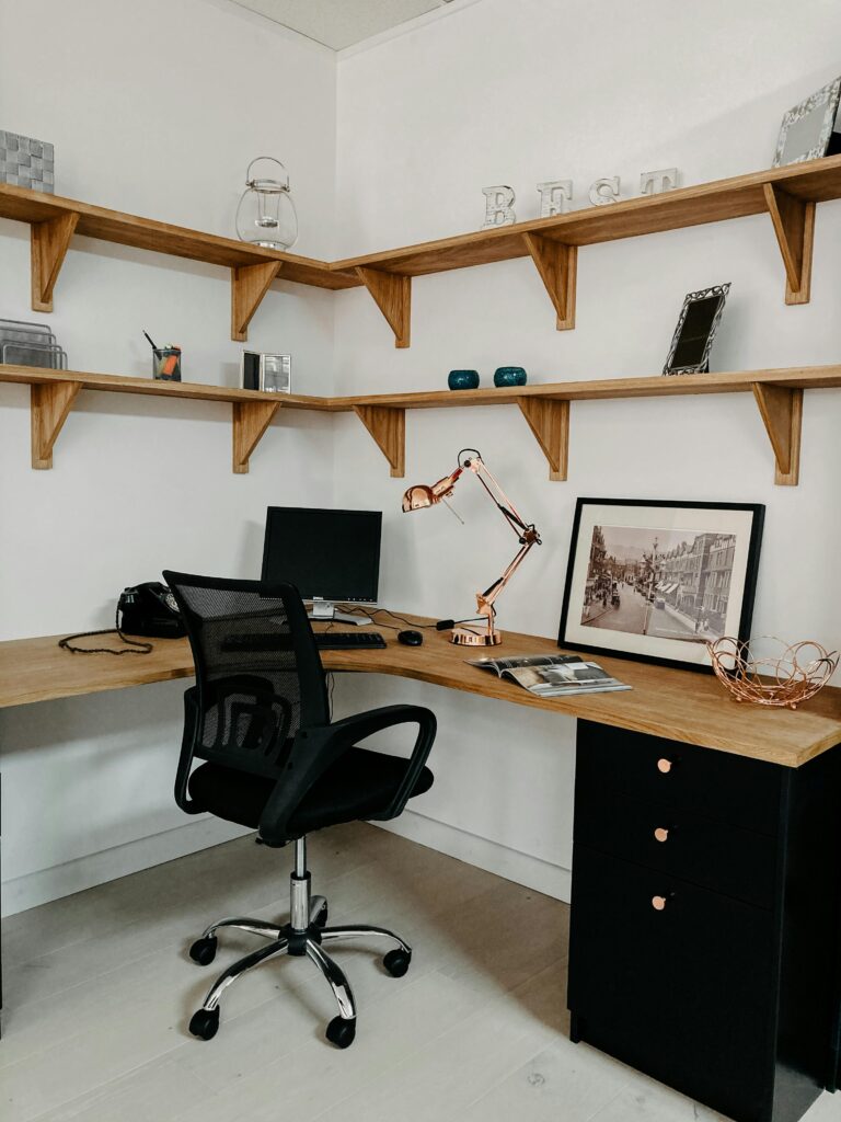 L Shape corner style desk. This image is to go with an article discussing maximising workspace efficiency and productivity.