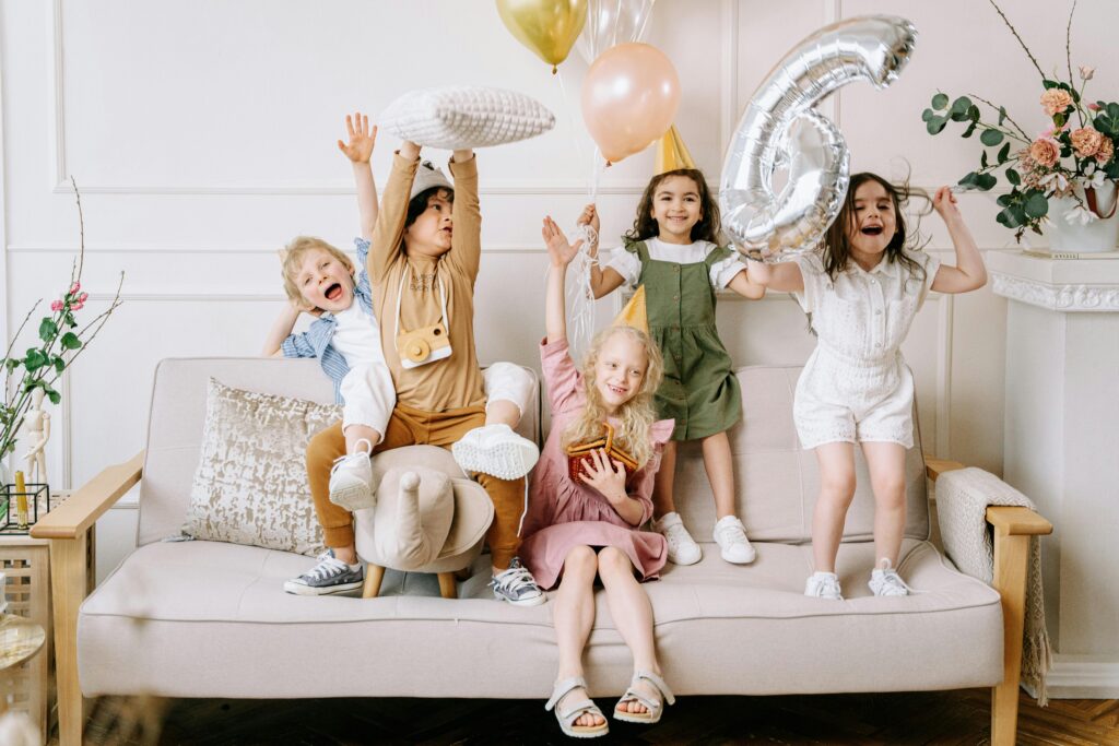 Children celebrating 6th birthday party.