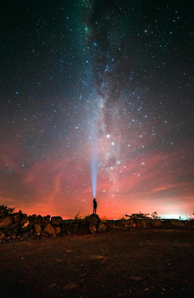 waterproof flashlight looking up to night stars.