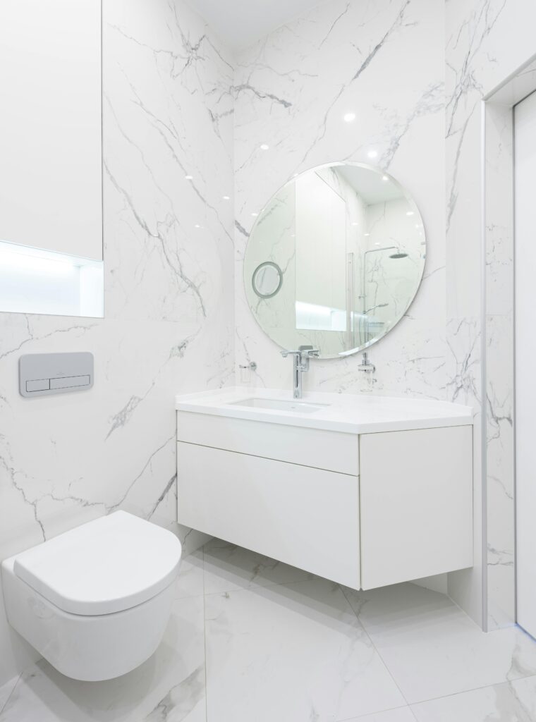 White glossy modern minimalist bathroom design.