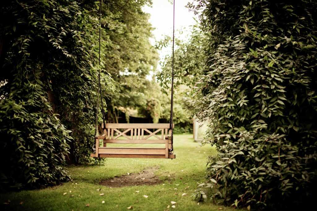 Swing in developed new build home garden.