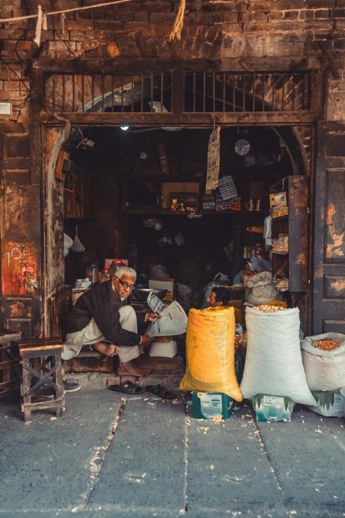 Man sitting in shop in Pakistan.