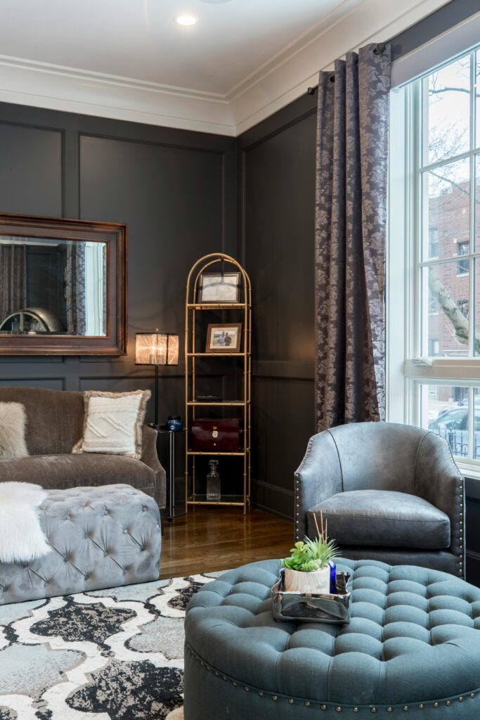 Living room space with a rug and fluted panels.