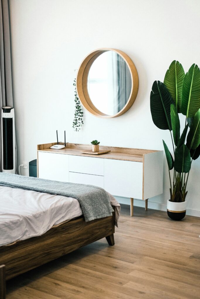 Greenery makes a statement in a neutral bedroom.