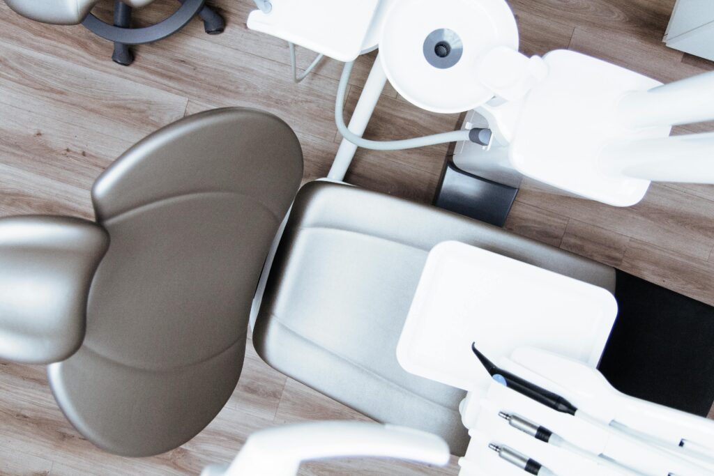 Overhead view of a dentist chair and dental equipment.
