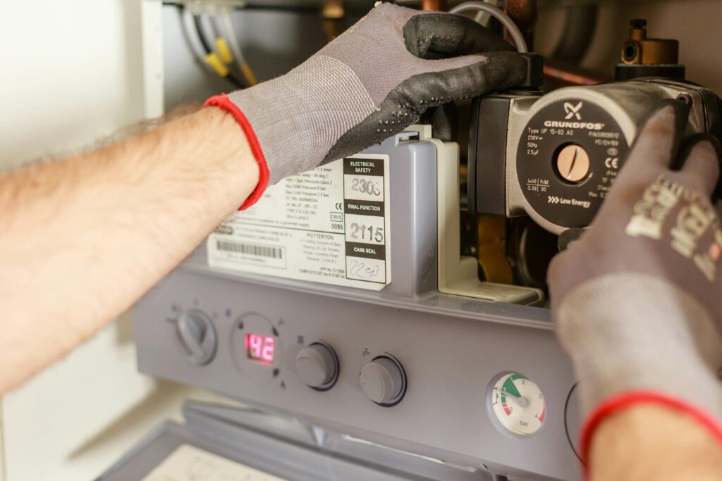 Man working on a boiler repair.