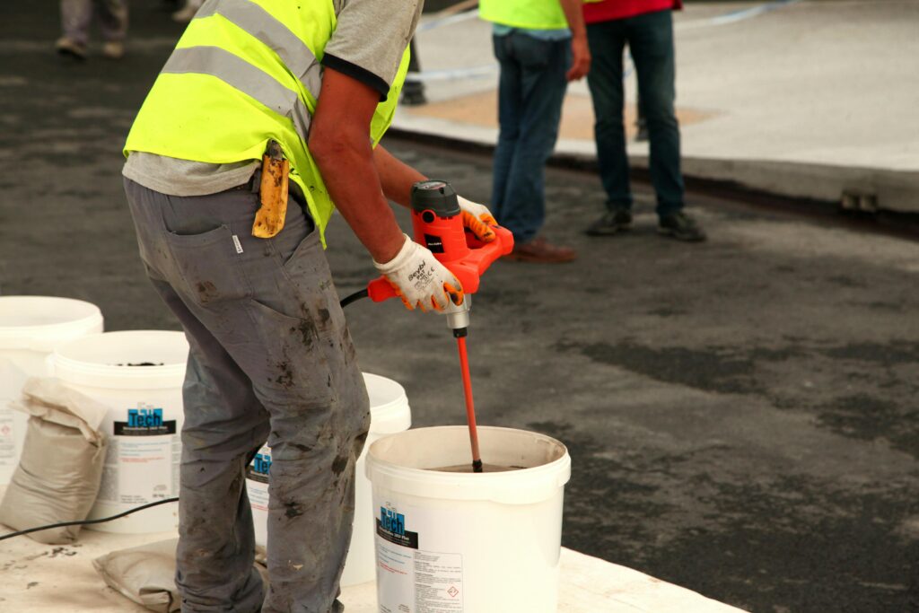 Man using a concrete mixer.