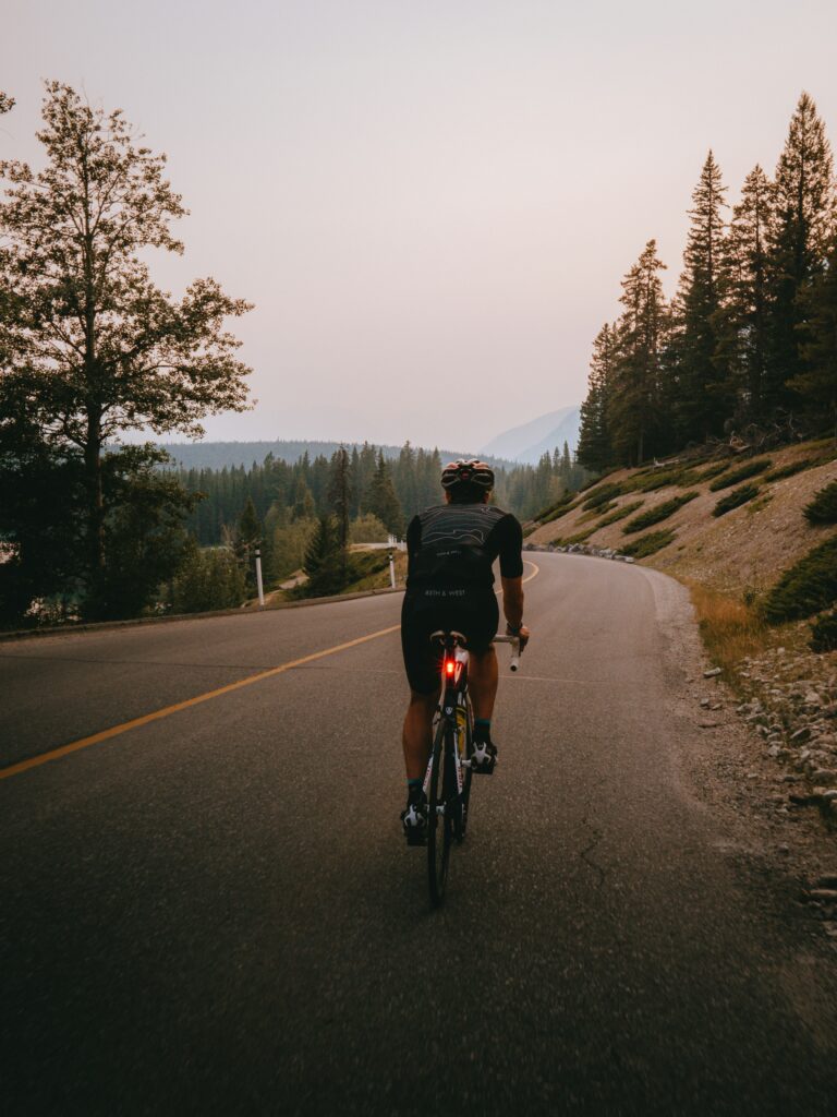 Cyclist riding down the road.