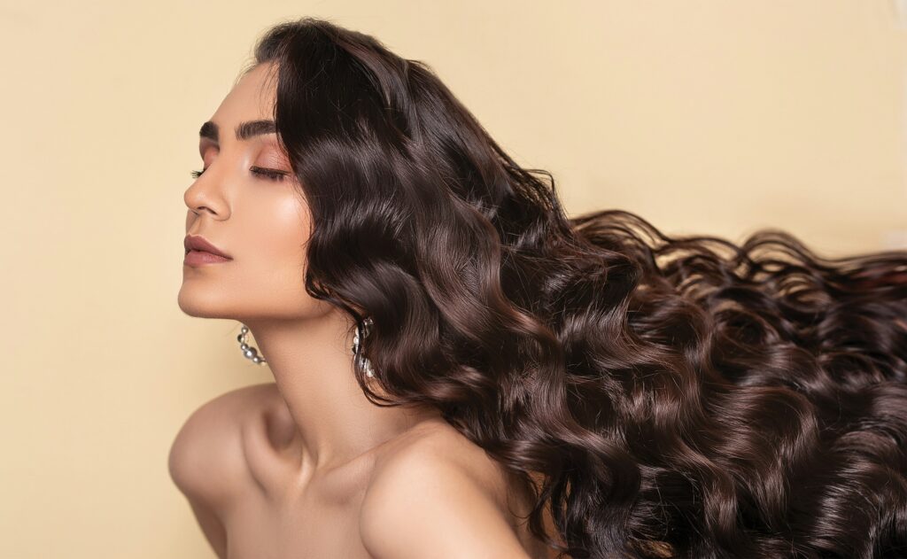 Woman with long flowing shiny chocolate brown hair.