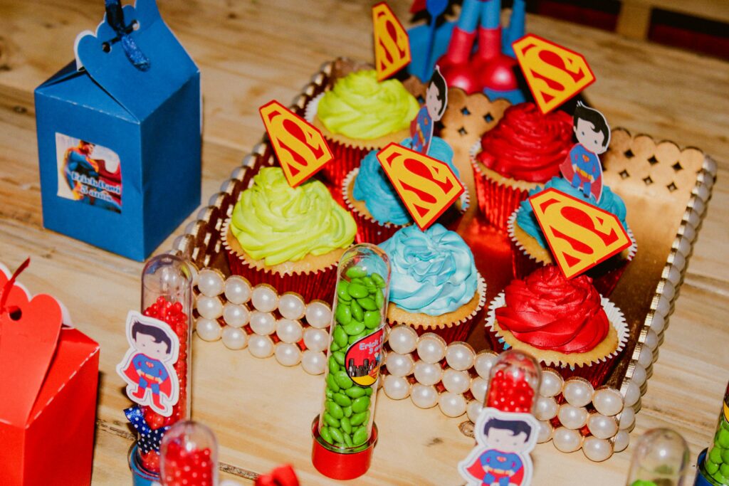 Kids superhero themed birthday cupcakes.
