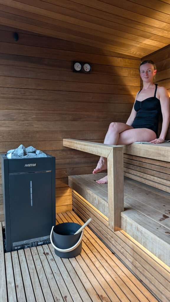 Claire Mac inside the sauna at Hewn.