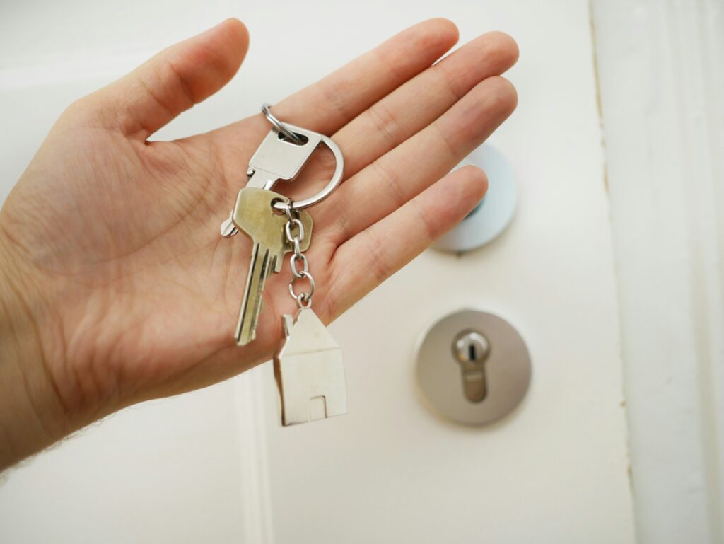 Person holding up a set of keys. This is to go with an article discussing whether is becoming a landlord the right move for you.