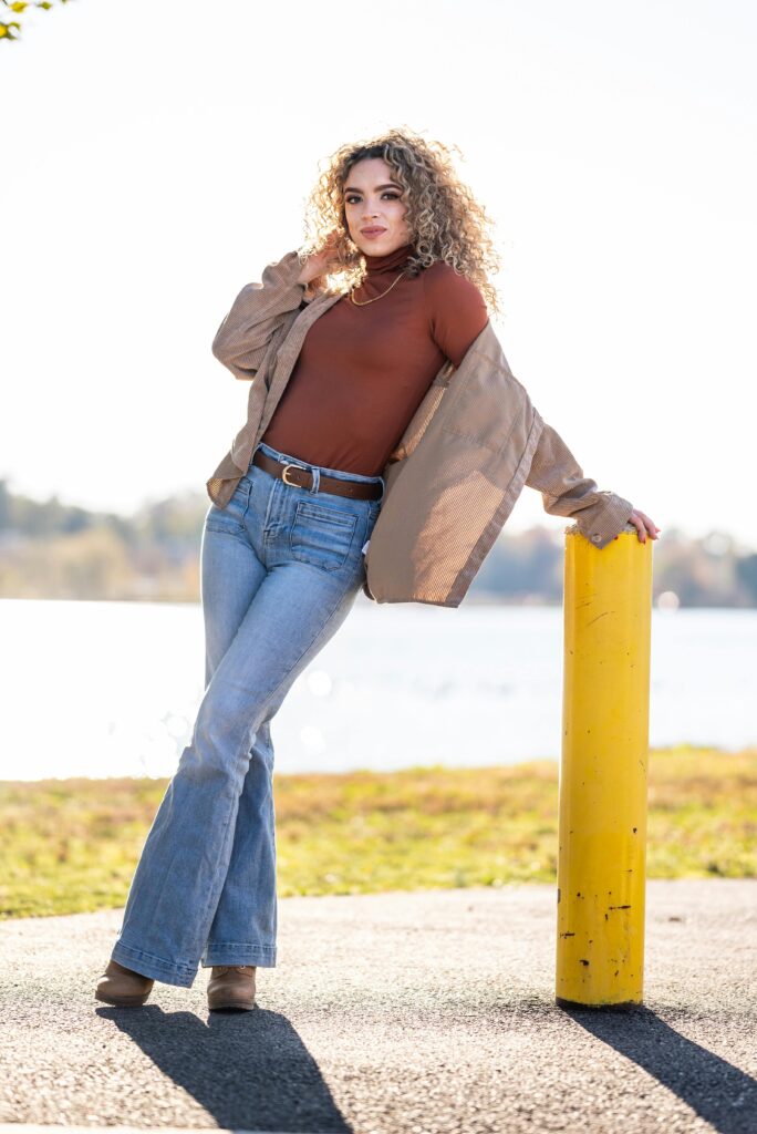 Woman wearing a pair of bootcut jeans.