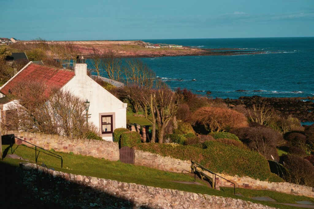 A quaint cottage by the sea. This is to go with an article exploring things to know before buying a holiday home.