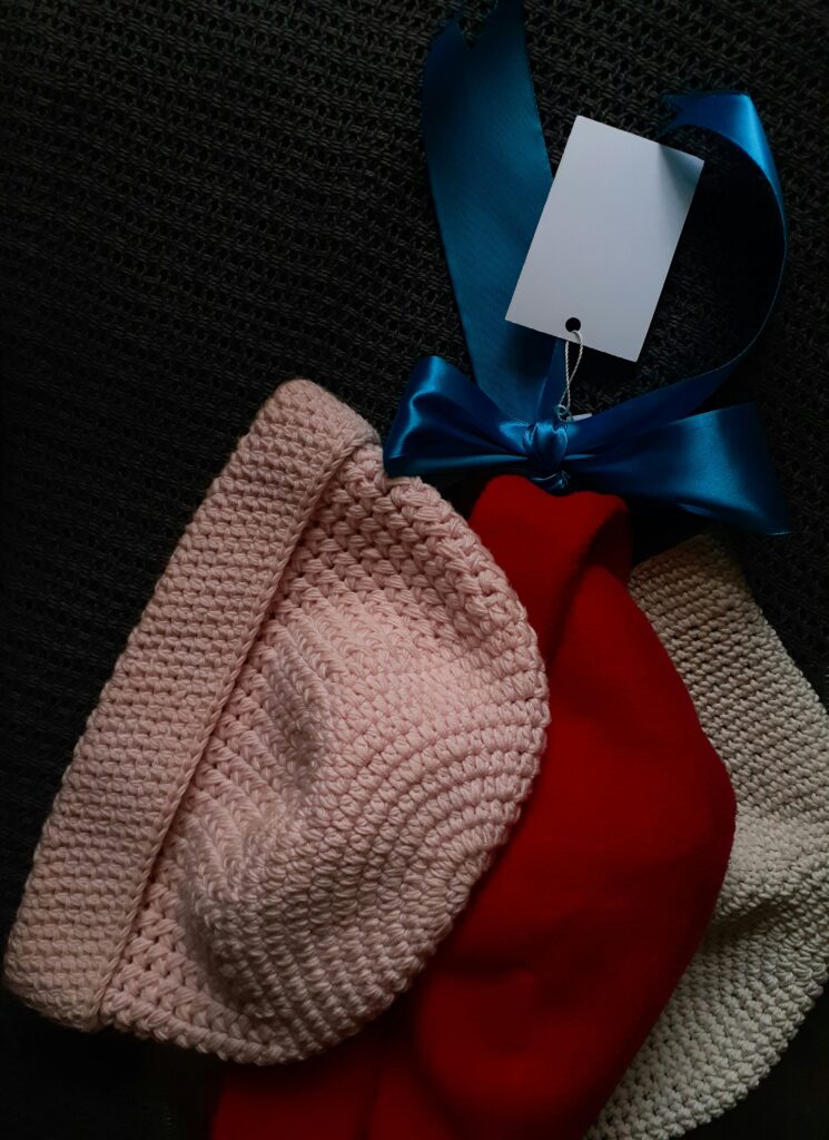 Hand knitted clothing.