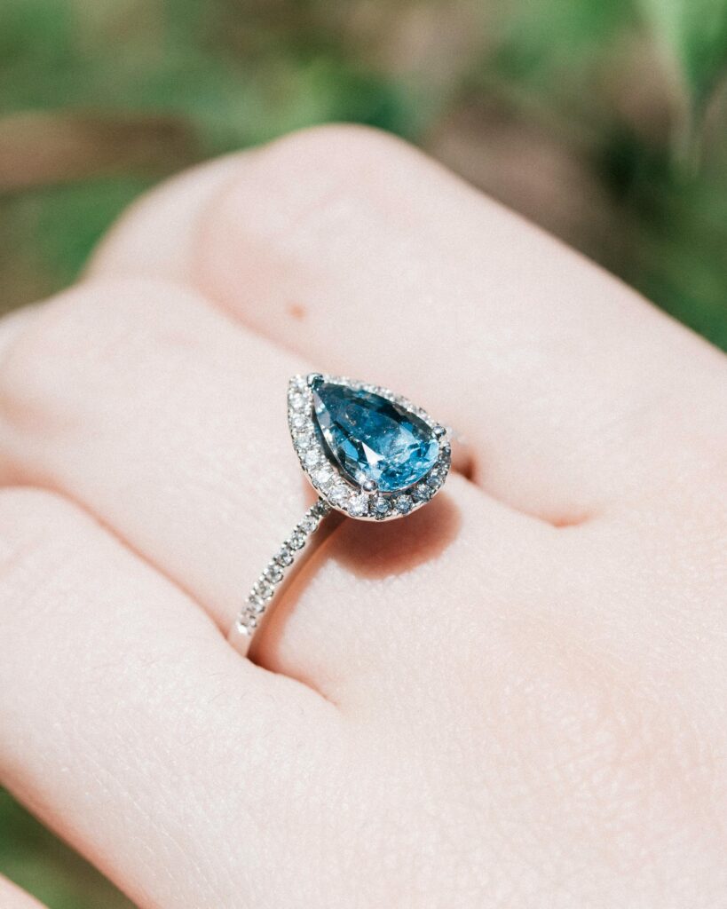 Pear shape blue stone white gold engagement ring.